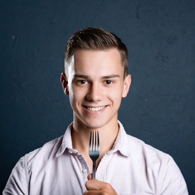 Young man holding fork