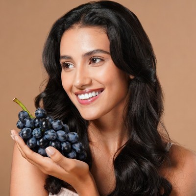 Woman holding grapes