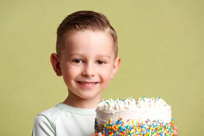 Boy holding birthday cake
