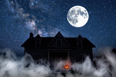 Haunted House with Jack-o-Lantern Under Full Moon