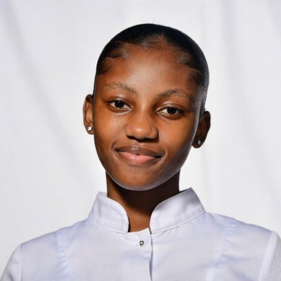 African-American girl smiling in white uniform