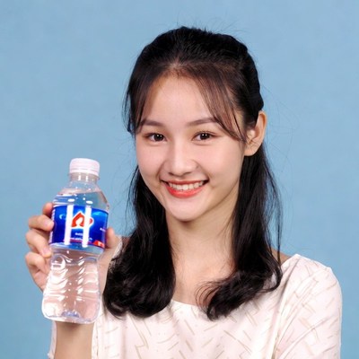 Asian woman holding water bottle
