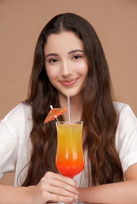 Woman holding tropical cocktail drink