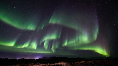 Vibrant Northern Lights over Landscape