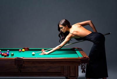 Woman playing pool in black dress
