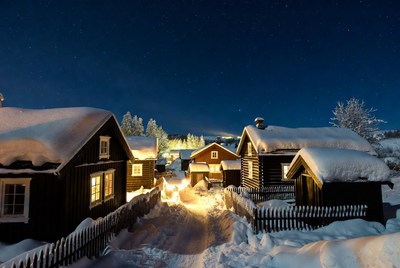 Snowy Wooden Houses at Night
