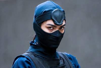 Asian woman in ninja mask