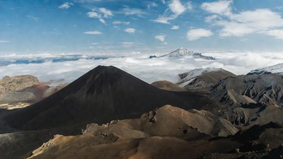 Volcanic Mountains Above Clouds