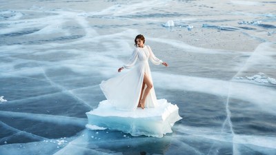 Woman in white dress on ice floe