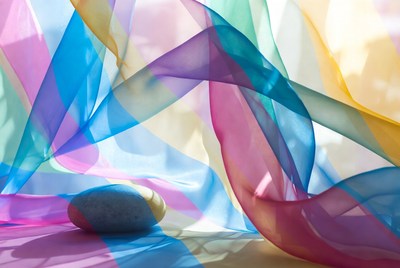 Colorful translucent fabrics with gray stone