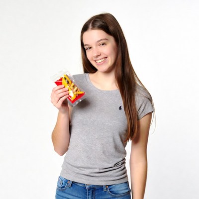 Teen girl holding french fries bag