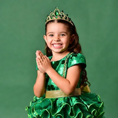 Girl in green dress with crown