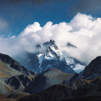 Snowy Mountain Peak in Clouds