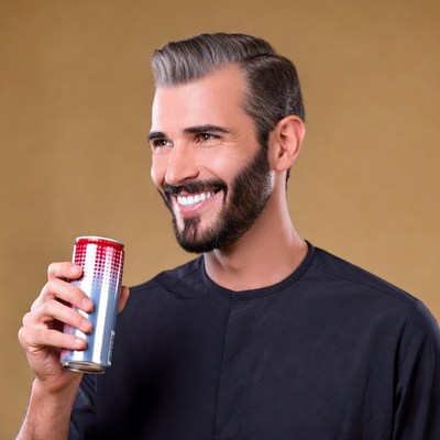 Man holding red energy drink