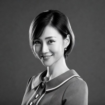 Asian woman smiling in suit