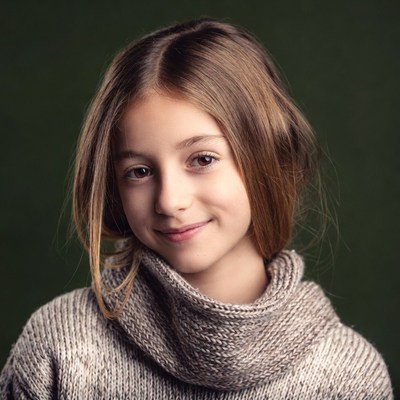 Smiling girl in turtleneck sweater