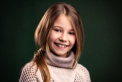 Smiling girl in knit sweater