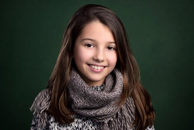 Smiling girl in gray scarf