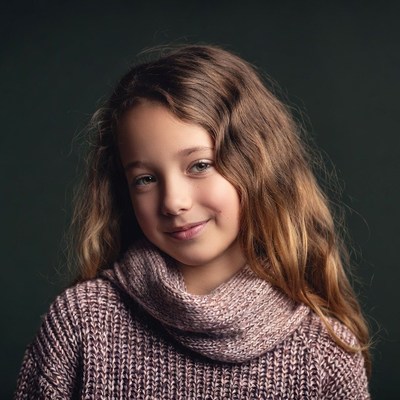 Smiling girl in pink turtleneck sweater