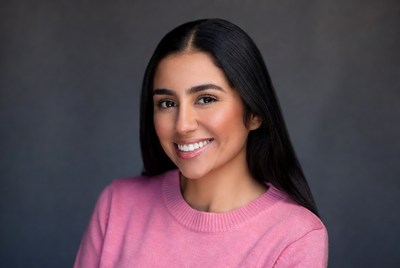 Smiling woman in pink sweater