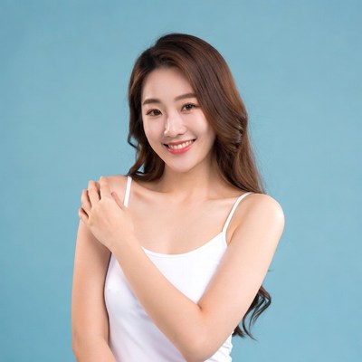 Asian woman smiling in white camisole