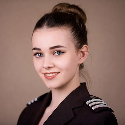 Young woman in flight attendant uniform