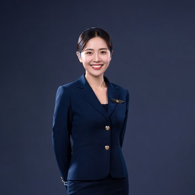 Asian woman in flight attendant uniform