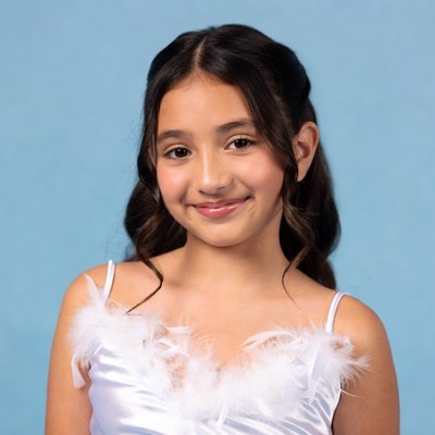 Smiling girl in white feathered dress