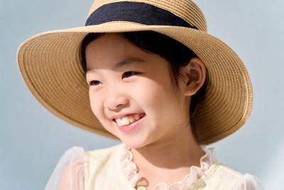 Asian girl smiling in straw hat