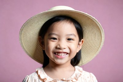 Asian girl smiling in straw hat