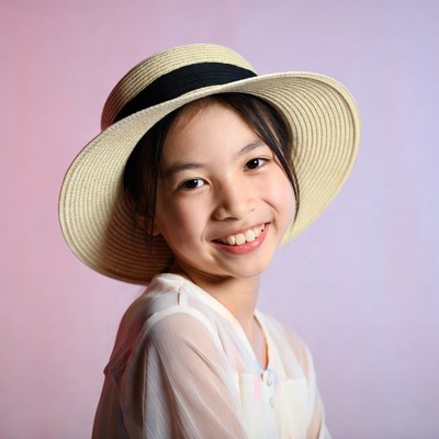 Asian girl smiling in straw hat