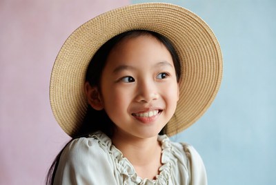 Asian girl smiling in straw hat