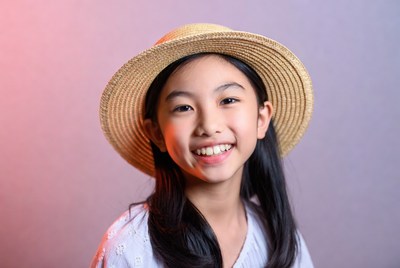 Asian girl smiling in straw hat