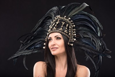 Woman wearing feathered headdress