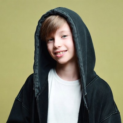 Boy smiling in black hoodie