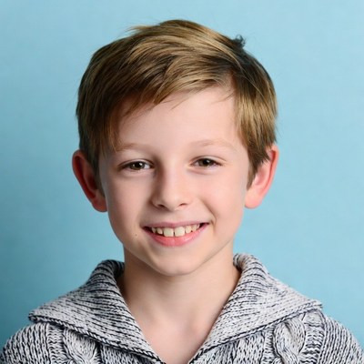 Smiling boy with short brown hair