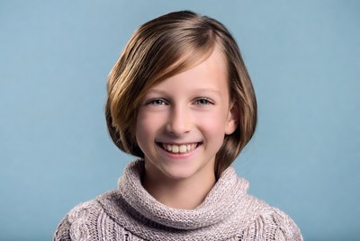 Smiling girl in turtleneck sweater