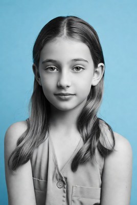 Young girl portrait on blue background