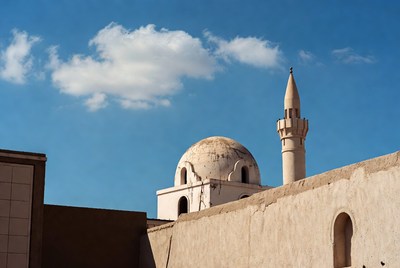 White Mosque Minaret Against Blue Sky