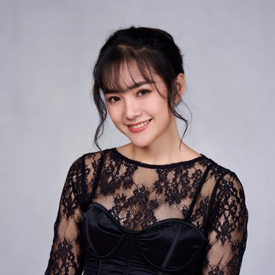 Asian woman in black lace dress