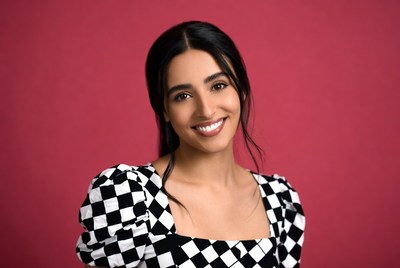 Smiling woman in checkered top
