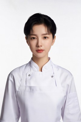 Asian woman in white chef uniform