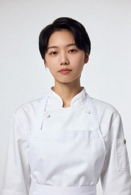 Asian woman chef in white uniform