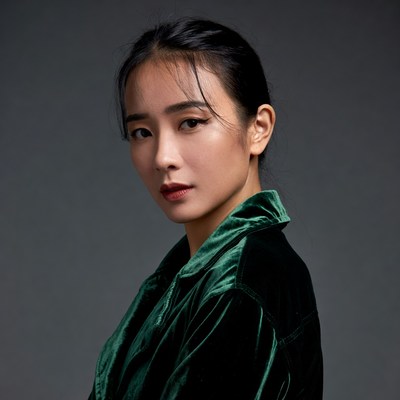 Asian woman in green velvet jacket