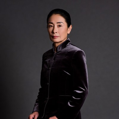 Asian woman in purple velvet qipao