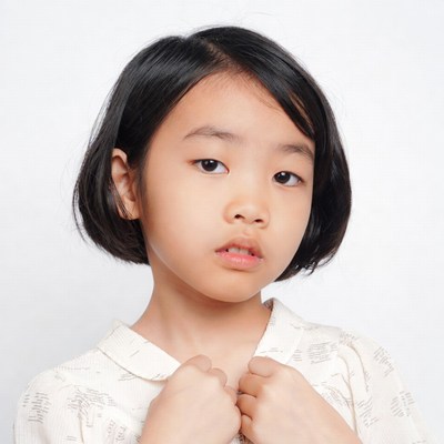 Asian girl adjusting collar