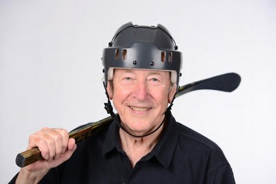 Elderly man with hockey helmet and stick