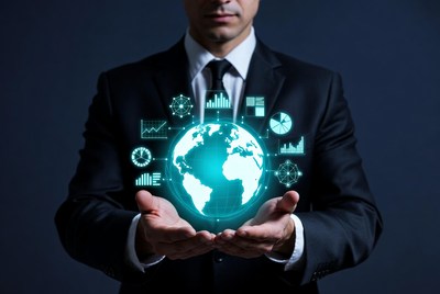 Businessman holding glowing world analytics