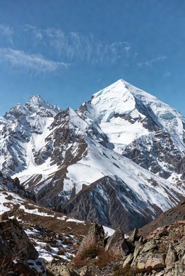 Snowy Mountain Peak Under Blue Sky
