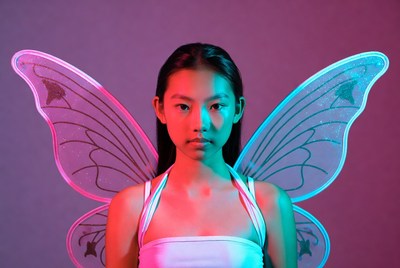 Asian girl with neon fairy wings